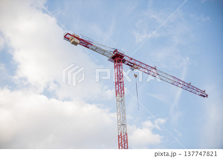 Image of a Work Crane in a Construction with the background of shiny sky 137747821