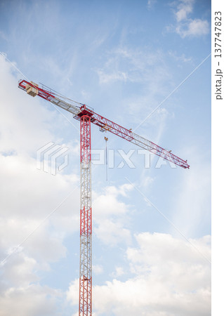 Image of a Work Crane in a Construction with the background of shiny sky Image of a Work Crane in a Construction with the background of shiny sky 137747823
