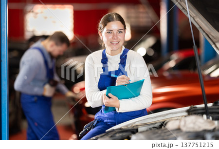 car service employee fills out a paper car service employee fills out a paper 137751215