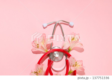 Flowers surround a stethoscope symbolizing nursing and care Flowers surround a stethoscope symbolizing nursing and care 137751336