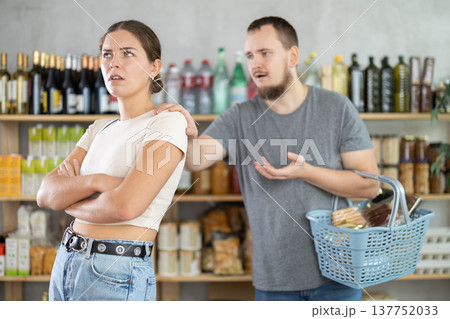 Angry girl turned away from husband during quarrel, he want to make peace after quarrel, calm wife Angry girl turned away from husband during quarrel, he want to make peace after quarrel, calm wife 137752033
