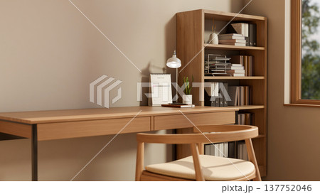 Calendar and lamp and pot plant on wooden table and chair aside bookshelf and window in room corner. Calendar and lamp and pot plant on wooden table and chair aside bookshelf and window in room corner. 137752046