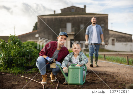 Woman with her son in the garden on the farm 137752054