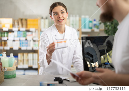 Female pharmacist gives man prescription pills Female pharmacist gives man prescription pills 137752113