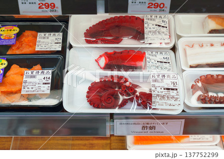 Tokyo, Japan - Oct 14 2024, Close-up view of a grocery store counter with various packaged seafood, octopus, fish, squid, etc., Ginza district, no people Tokyo, Japan 137752299