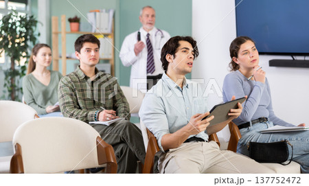 Students in medical courses listen to a lecture 137752472