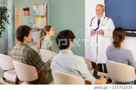 Male doctor giving a lecture to students 137752535