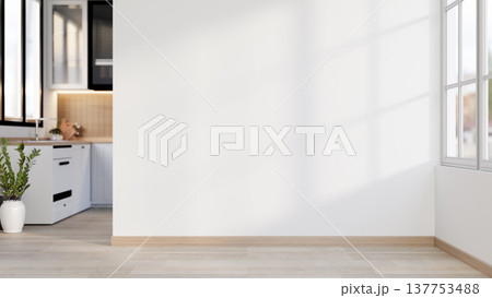 White wall over wooden parquet floor corridor to kitchen room with sunlight shining through window. 137753488