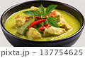 Thai green curry chicken bowl, coconut milk soup, red chili, basil garnish, closeup comfort food, aromatic asian cuisine 137754625