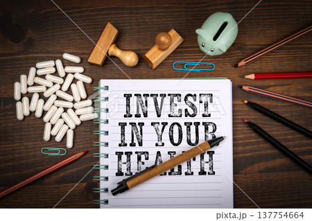 Invest In Your Health Notebook With Pills And Piggy Bank Invest In Your Health Notebook With Pills And Piggy Bank 137754664