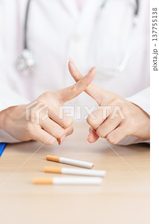 doctor hand making stop sign to refuse and breaking cigarette, quitting smoking for healthy lungs, prevent Lung Cancer and Emphysema, World No Tobacco Day concept 137755138