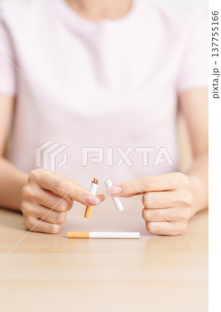 woman hand break cigarette for World No Tobacco Day concept, quitting smoking to prevent Lung Cancer, COPD, Emphysema and Tuberculosis disease. healthy lifestyle resolution, stop nicotine addiction woman hand break cigarette for World No Tobacco Day concept, quitting smoking to prevent Lung Cancer, COPD, Emphysema and Tuberculosis disease. healthy lifestyle resolution, stop nicotine addiction 137755166