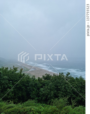 It is a foggy seascape.	 137755523