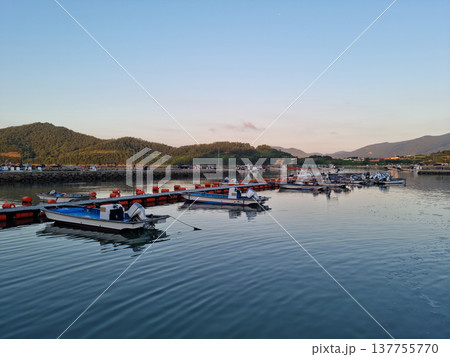 This is a view of an island village at sunset. This is a view of an island village at sunset. 137755770