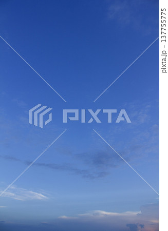 It is a sunset sky with feathery clouds. It is a sunset sky with feathery clouds. 137755775