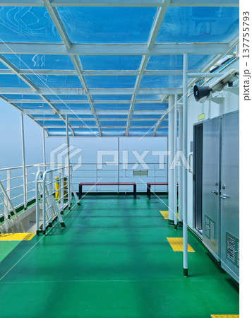 This is a view of the deck of a passenger ship. This is a view of the deck of a passenger ship. 137755793