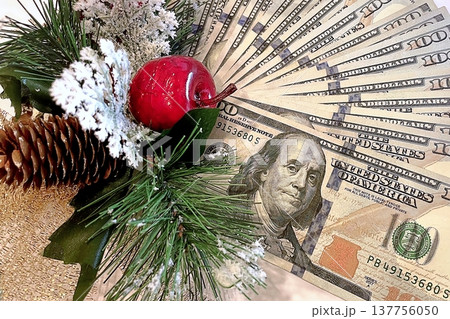 Christmas Cash and Holiday Decorations. $100 dollar bills with festive ornaments. Perfect for holiday budget, bonus, and shopping concepts. 137756050