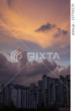 It's a beautiful sunset and apartment scenery.	 137756170