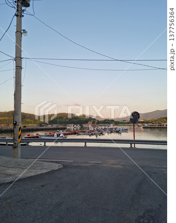 This is a view of an island village at sunset.	 137756364