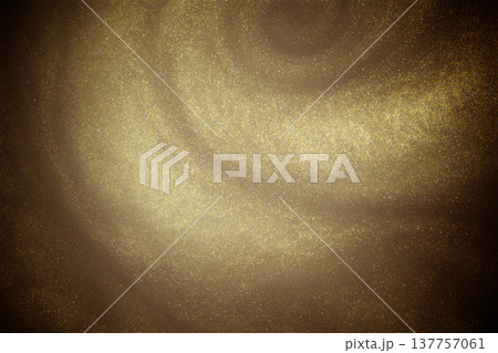 Golden glitter dust on dark background. 137757061