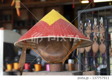 Traditional Vietnamese conical hat display at local souvenir market in Hoi An 137757911
