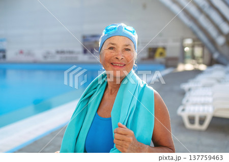 Senior woman getting ready for swim. 137759463
