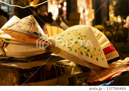 Traditional Vietnamese hats for sale at Hoi An night street market Traditional Vietnamese hats for sale at Hoi An night street market 137760469