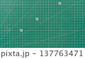 Green cutting mat with patterns or lines indicating the angle and size of the paper. For background and textured. 137763471