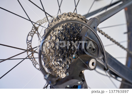 Bicycle drivetrain close up with cassette chain and disc brake Bicycle drivetrain close up with cassette chain and disc brake 137763897