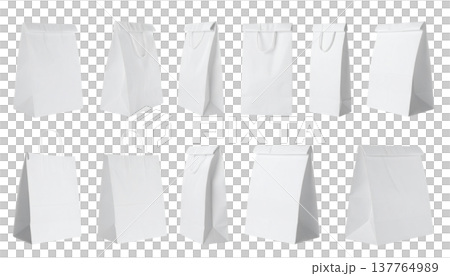 An empty white paper bag with handles lies on a white background. An empty white paper bag with handles lies on a white background. 137764989