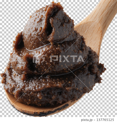 Scoop of dark brown organic miso paste on wooden spoon, showing its thick, textured, and rich fermented soybean paste with natural look Scoop of dark brown organic miso paste on wooden spoon, showing its thick, textured, and rich fermented soybean paste with natural look 137765125