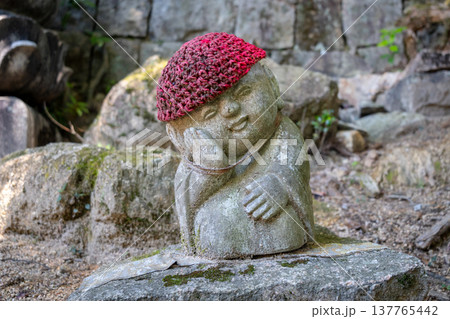Jizo Bosatsu statue with red hat on Miyajima Island, Japan Jizo Bosatsu statue with red hat on Miyajima Island, Japan 137765442