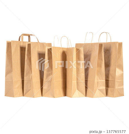 Empty brown paper bags with handles are placed separately on a white background. 137765577