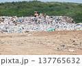 Municipal garbage dump at landfill. Environmental pollution. 137765632
