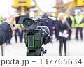News conference. Filming media event with a video camera. 137765634