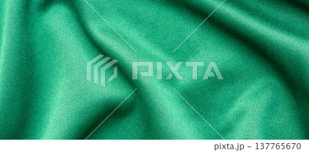 Green sports clothing fabric football shirt jersey texture close up Green sports clothing fabric football shirt jersey texture close up 137765670