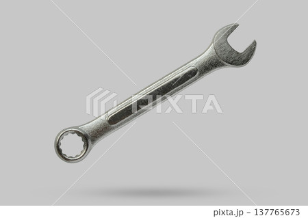Wrench fly over gray background close up Wrench fly over gray background close up 137765673