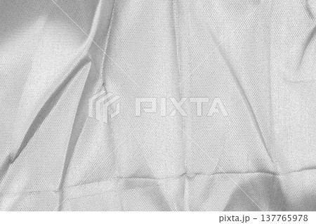 Crumpled shiny silver fabric metal texture background 137765978
