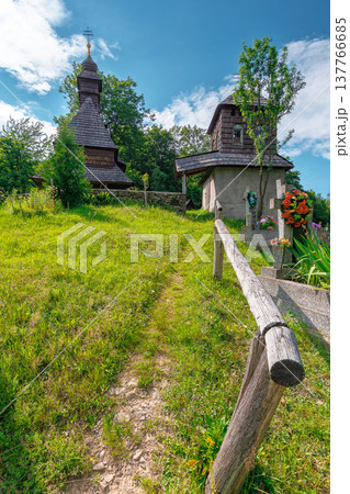 traditional wooden church architecture. likitsary, transcarpathia, ukraine - 02 jul 2020: traditional wooden church architecture. picture of an old traditional wooden church architecture. likitsary, transcarpathia, ukraine - 02 jul 2020: traditional wooden church architecture. picture of an old 137766685