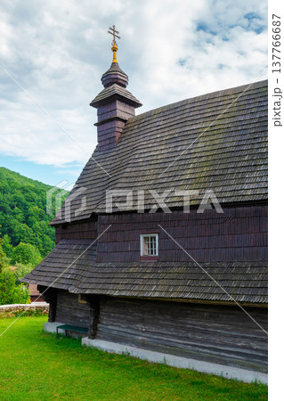 traditional wooden church architecture. likitsary, transcarpathia, ukraine - 02 jul 2020: traditional wooden church architecture. picture of an old 137766687