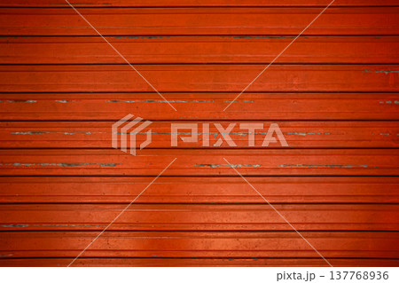 Closeup red metallic rolling door background. Metal shutter background. Steel roller shutter pattern Closeup red metallic rolling door background. Metal shutter background. Steel roller shutter pattern 137768936