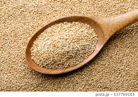 Raw amaranth grain in a wooden spoon background. Top view 137769103
