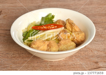fried white garlic chive with slice yellow egg tofu and chili on bowl fried white garlic chive with slice yellow egg tofu and chili on bowl 137771659