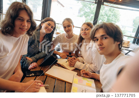 Making selfie. Group of young friends are in the cafe restaurant Making selfie. Group of young friends are in the cafe restaurant 137771705