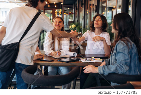 Group of young friends are in the cafe restaurant Group of young friends are in the cafe restaurant 137771785