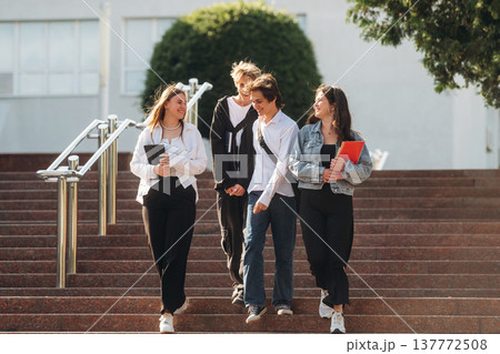 Going forward. Group of students are near university together Going forward. Group of students are near university together 137772508