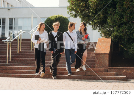 Going forward. Group of students are near university together Going forward. Group of students are near university together 137772509