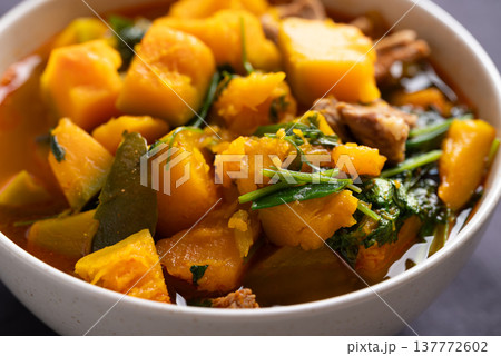 Close up of Thai spicy pumpkin curry soup with pork in a bowl Close up of Thai spicy pumpkin curry soup with pork in a bowl 137772602