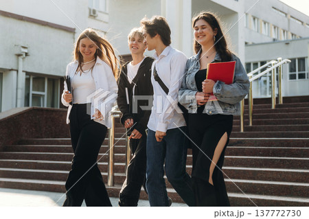 University building behind. Group of students are together 137772730