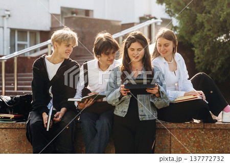 University building behind. Group of students are together University building behind. Group of students are together 137772732